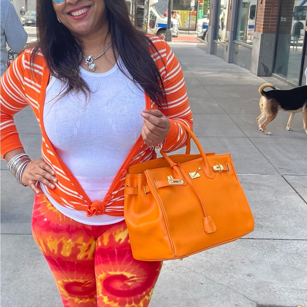 Bright Orange Striped Cardigan with Matching Handbag. Used has few flaws